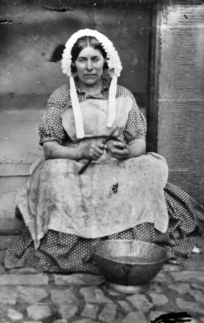Kitchen maid peeling potatoes, Corstorphine, 1880s. SLA.C.1830