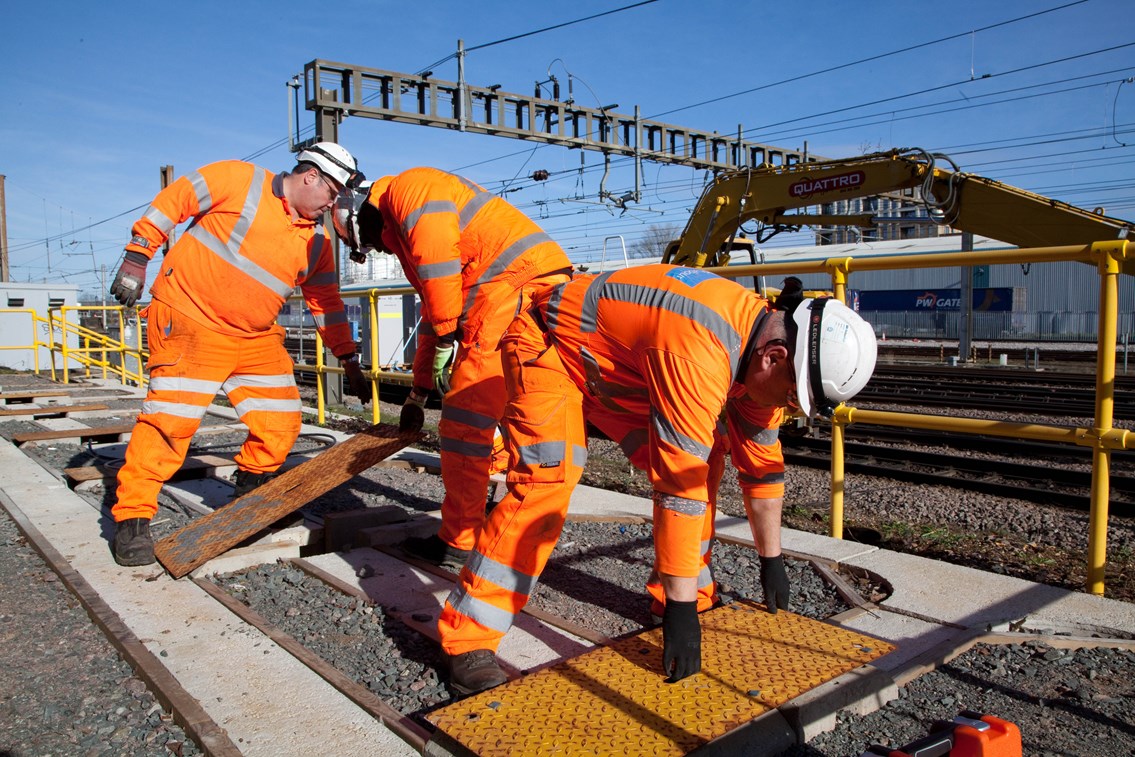 Engineers fitting new cables as part of the East Coast Digital Programme