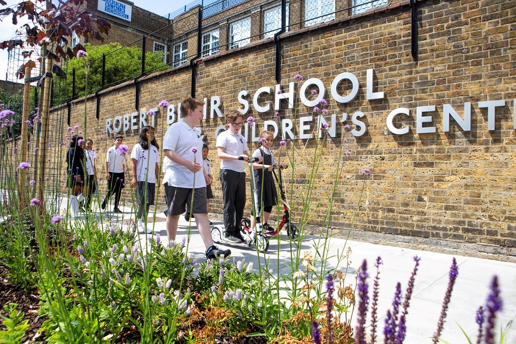 Schoolchildren walk and wheel on the improved streets outside Robert Blair Primary School