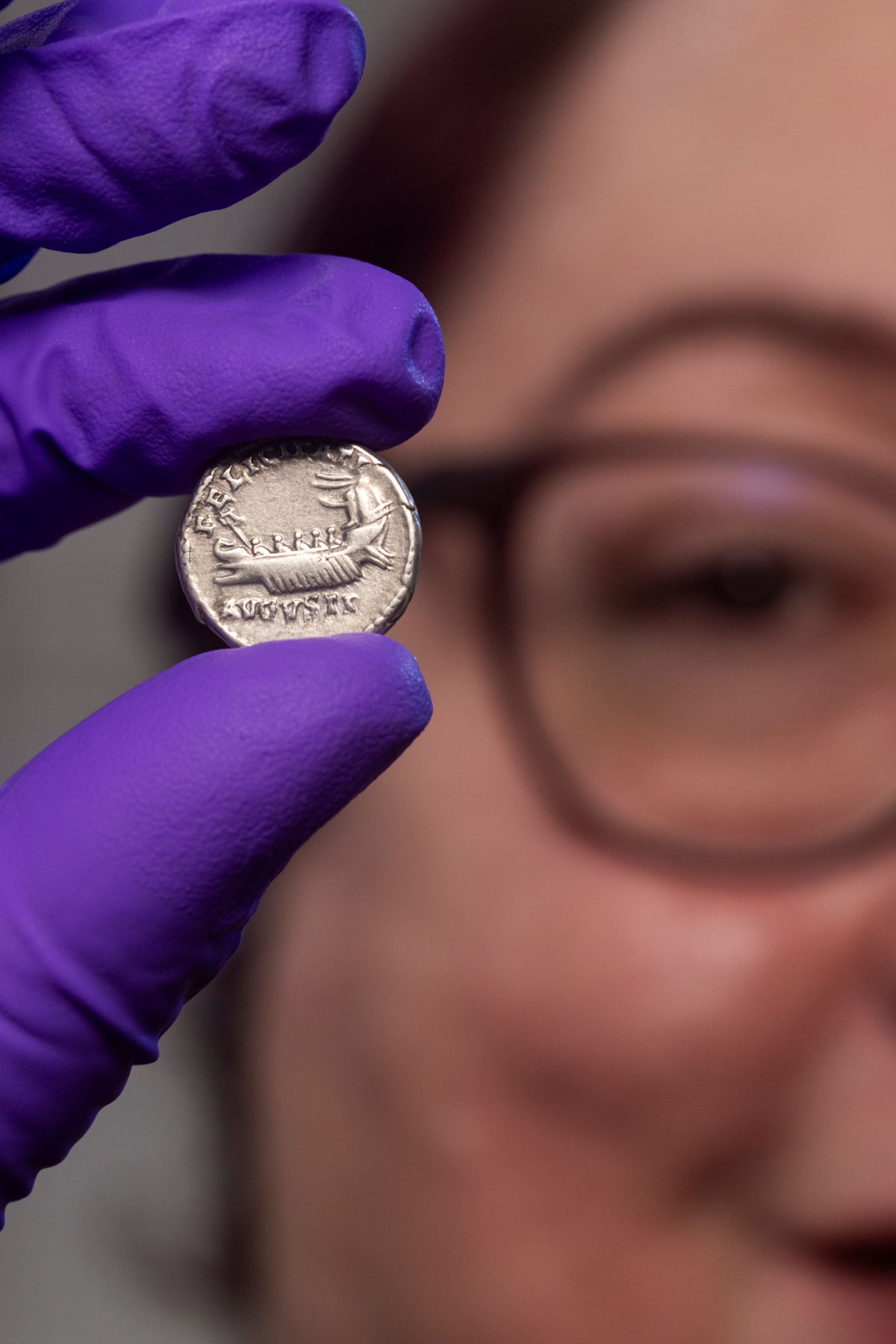 Conservator Carolyn Keene examines a Roman silver denarius. Image © Duncan McGlynn (3)