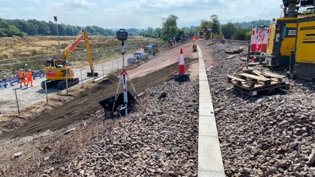 Positive progress being made in restoring railway between Haywards Heath and Lewes following derailment: View of railway embankment with work underway