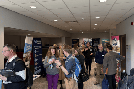 Attendees chatting during the conference held at the University of Cumbria's Lancaster campus