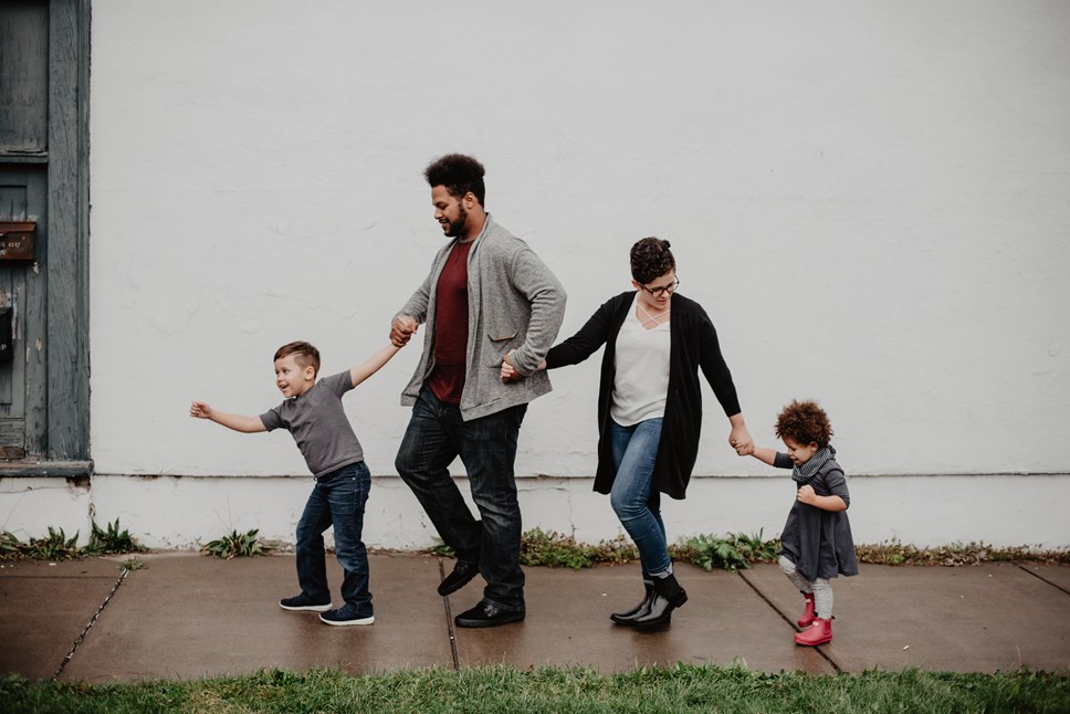 family-of-four-walking-at-the-street-2253879-2