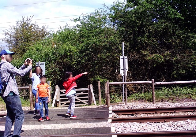 Network Rail issues warning after a family were found taking photographs on the railway lines in Essex: Knights level crossing misuse 2