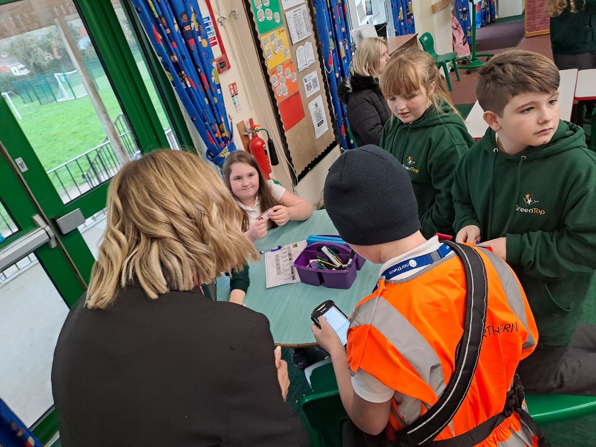 Image shows schoolchildren with Northern staff 2