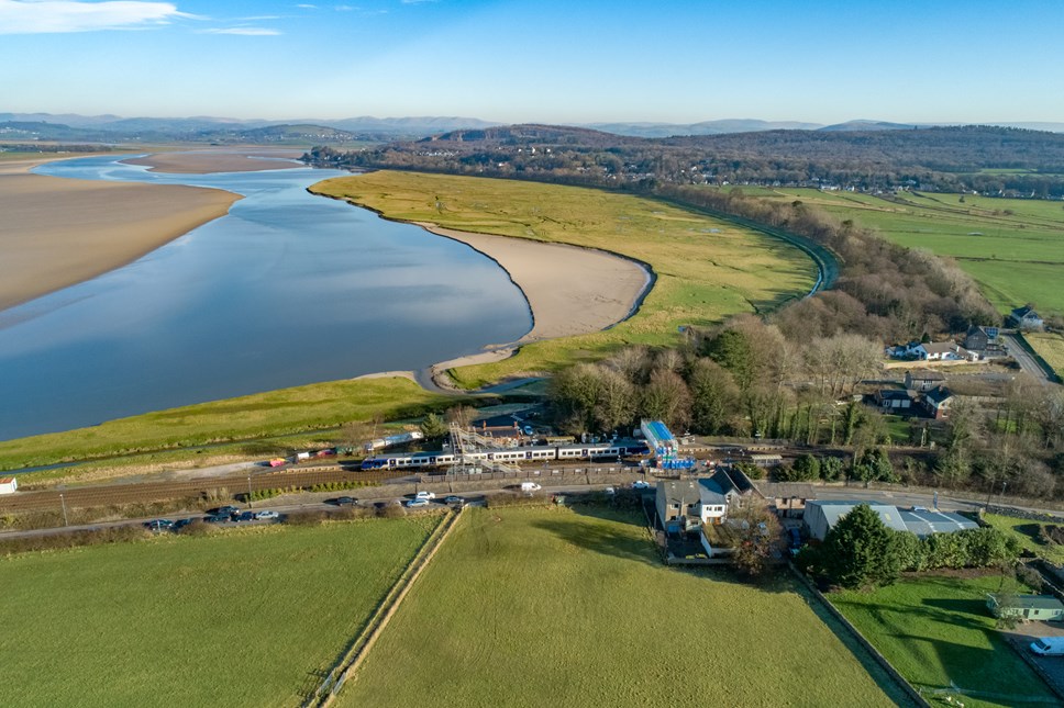 This image shows a Northern train travelling past Arnside