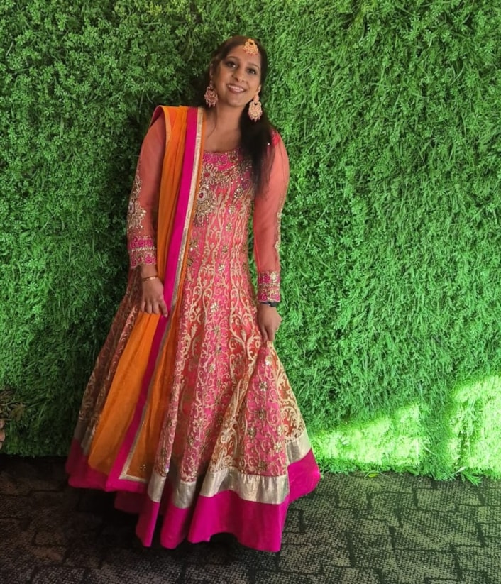 Kidney donor appeal 3: Image shows Surinder smiling at the camera in front of a hedgerow background.