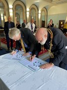 The Right Worshipful, the Lord Mayor of Portsmouth Councillor Canon Dr Hugh Mason (R) and Cllr Gerald Vernon-Jackson, Leader of Portsmouth City Council (L): The Right Worshipful, the Lord Mayor of Portsmouth Councillor Canon Dr Hugh Mason and Cllr Gerald Vernon-Jackson, Leader of Portsmouth City Council signing the Portsmouth Green Partnership Charter