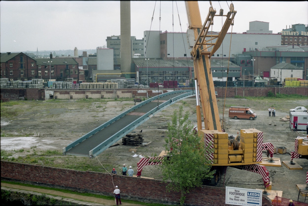 Centenary Bridge: Originally constructed in 1993, at that time the bridge was the first river crossing built in the city for more than a century, and its distinctive sweeping design has since become a much-loved riverside feature. Picture shows the bridge being winched into place during construction. Credit Yorkshire Design Group.