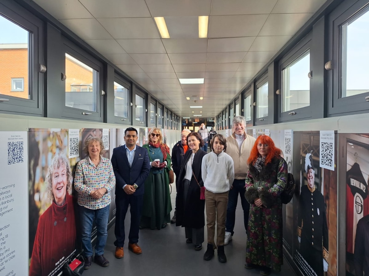 Residents standing with their portraits at Banbury Station