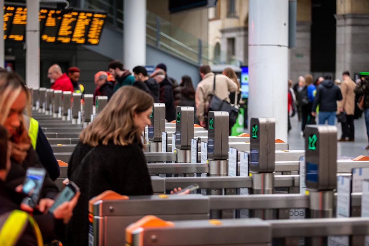 Customers walking through a gateline at Manchester Victoria station