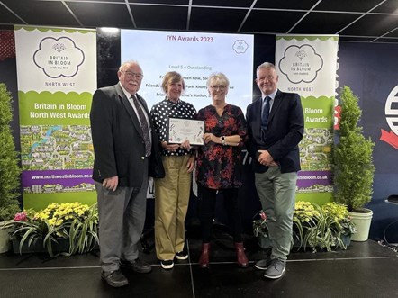 Image shows station adopter volunteers at the RHS Britain in Bloom awards