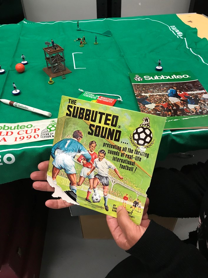Subbuteo collection: Kitty Ross, curator of social history, with accessories from the newly-acquired Subbuteo sets which have become part of the Leeds Museums and Galleries collection. These include a vinyl record of The Subbuteo Sound designed to be played during games.