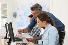 People working at computer screen