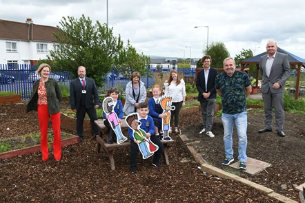 Cllr Cogley, HT Derek Forsyth, Cllr Campbell, Teacher Cleo Roy, Ivan Craig, Cllr McMahon and Bob McCulloch, Interim Head of Housing and Communities with Khali, Owen and Ellie