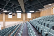 Wester Hailes HS assembly hall: A side-on view of the assembly hall at Wester Hailes High School, featuring rows of seating beneath a textured ceiling.