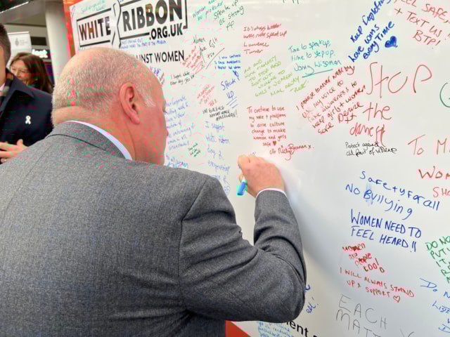 Andy Mellors, managing director for Avanti West Coast, signing the White Ribbon pledge wall: Andy Mellors, managing director for Avanti West Coast, signing the White Ribbon pledge wall