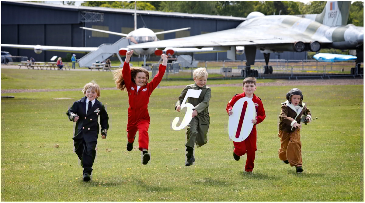 Murdo Waite, Ingrid Jamieson, Sebastian Sheppard, Charlie Calder and Walker Kelly from Athelstaneford Primary mark the National Museum of Flight’s 50th anniversary at East Fortune, East Lothian. Housed on a former Second World War airfield, the attraction opened its doors on 7 July 1975 and now houses an extensive collection of aircraft including a Red Arrows Hawk, a Supermarine Spitfire, a Vulcan bomber and Scotland’s Concorde.