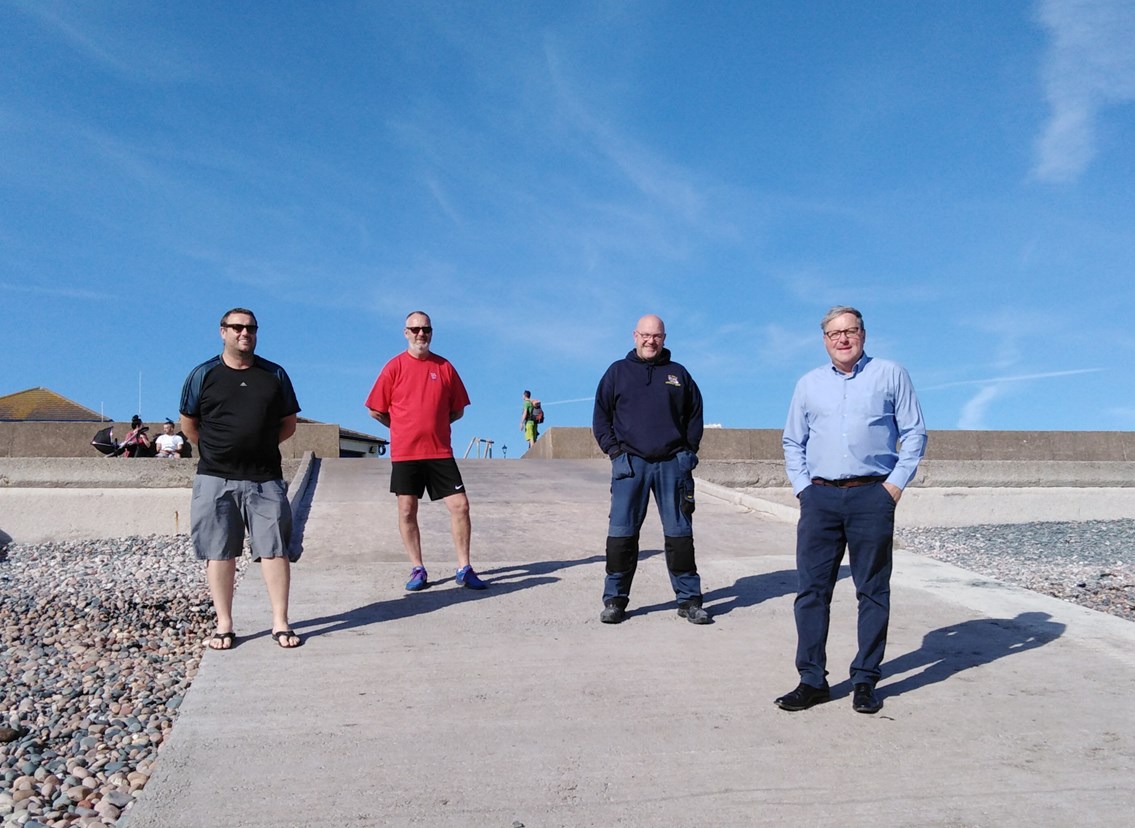 Jeffrey Hailes, Copeland Councillor for St Bees, on the far right with three RNLI volunteers.