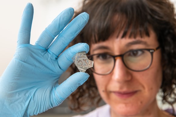 Medieval Islamic glass reveals untold histories: Clara Molina Sanchez, Applied Conservation Manager at HES, examines a piece of Islamic glass at the Engine Shed in Stirling.