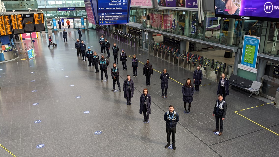 Manchester Piccadilly station makes its mark with new social distancing guides: Train crew and station staff on the social distancing guides at Manchester Piccadilly