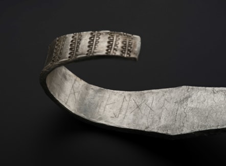 Galloway Hoard arm ring with runic inscription in view © National Museums Scotland