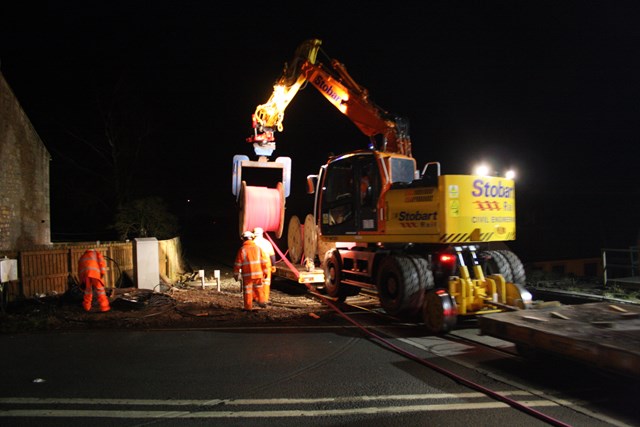 Cable being installed at trial site: new tough cable being installed at a trial site in the north east.  January 2009