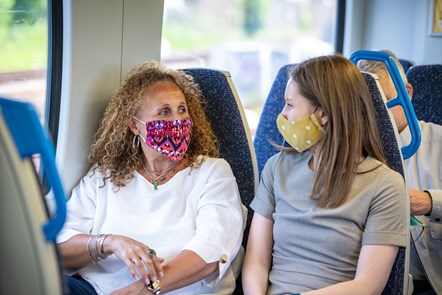 Passengers in conversation on Thameslink train