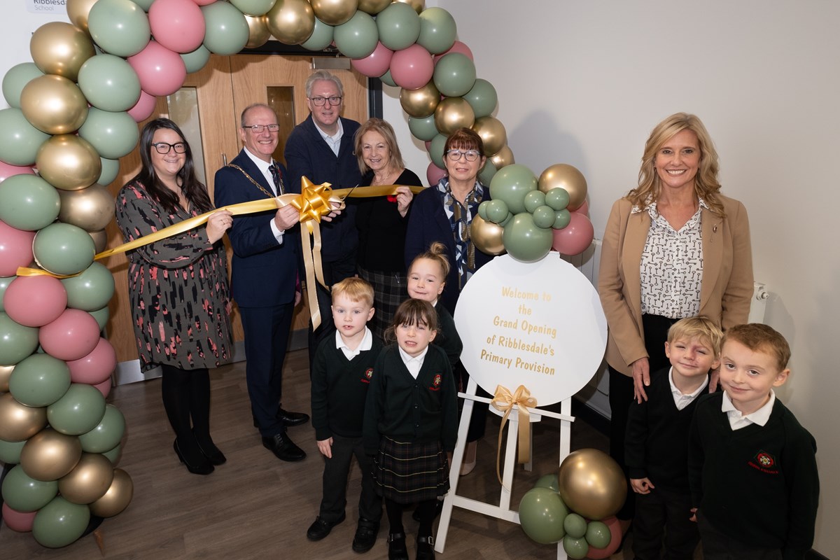 From L-R, Vice Chair of Governors Carrie Nestor, CC Tim Ashton, Tony Walsh Poet, CC Sue Hind, CC Jayne Rear and head with children