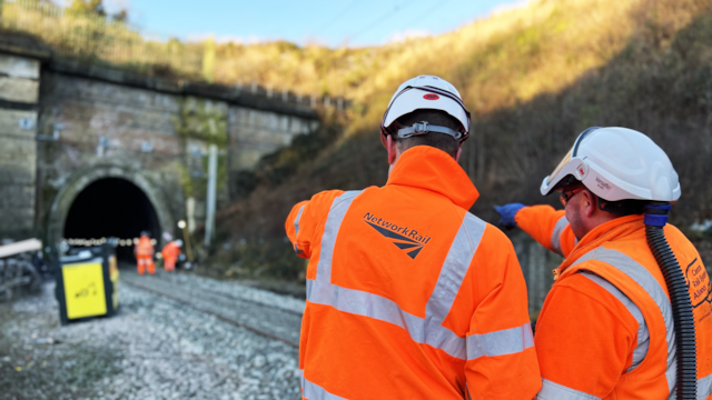 Trickily tight tunnel track upgrade complete on West Coast Main Line: Tunnel view with engineers in foreground