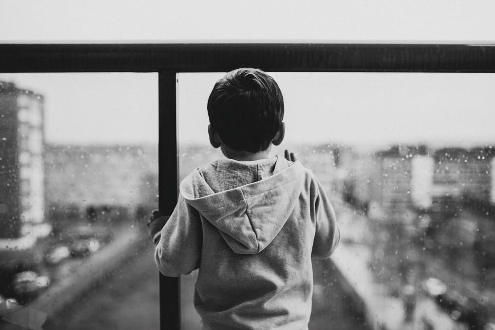 child in window monochrome