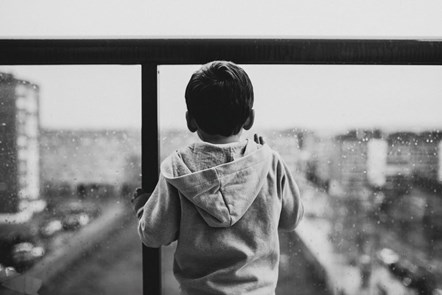 child in window monochrome