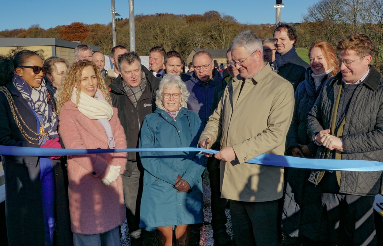 FAS2 Ribbon2jpg: Leader of Leeds City Council Cllr James Lewis cuts the ribbon to mark completion of the Leeds Flood Alleviation Scheme next to Baroness Judith Blake (in centre, former leader of the council) along with Lord Mayor of Leeds Councillor Abigail Marshall Katung (furthest left) and Cllr Jonathan Pryor, deputy leader of Leeds City Council and executive member for economy, transport and sustainable development (further right) together with invited partners and stakeholders.