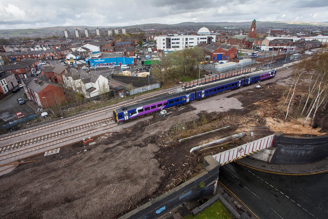 First phase of work to upgrade railway between Littleborough and Manchester Victoria completed on time: A Northern train passes over upgraded track near Rochdale station