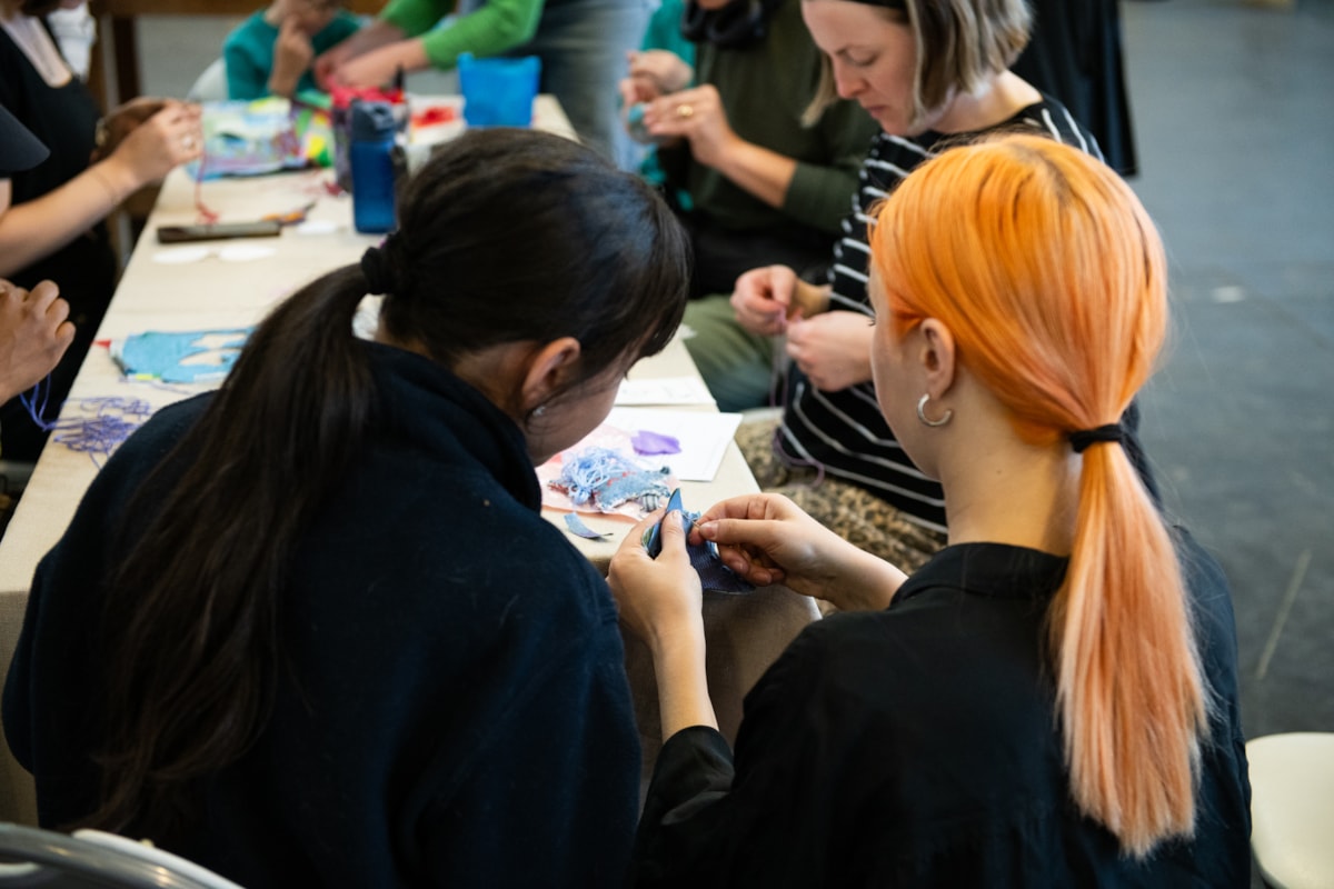 Two women taking part of a sewing, mending and textile workshop at Arbeit Studios in Hackney Wick