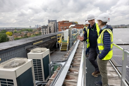 A group is taken on a tour of the newly decarbonised Waste and Recycling Centre. The photo shows a group on the roof of the building.