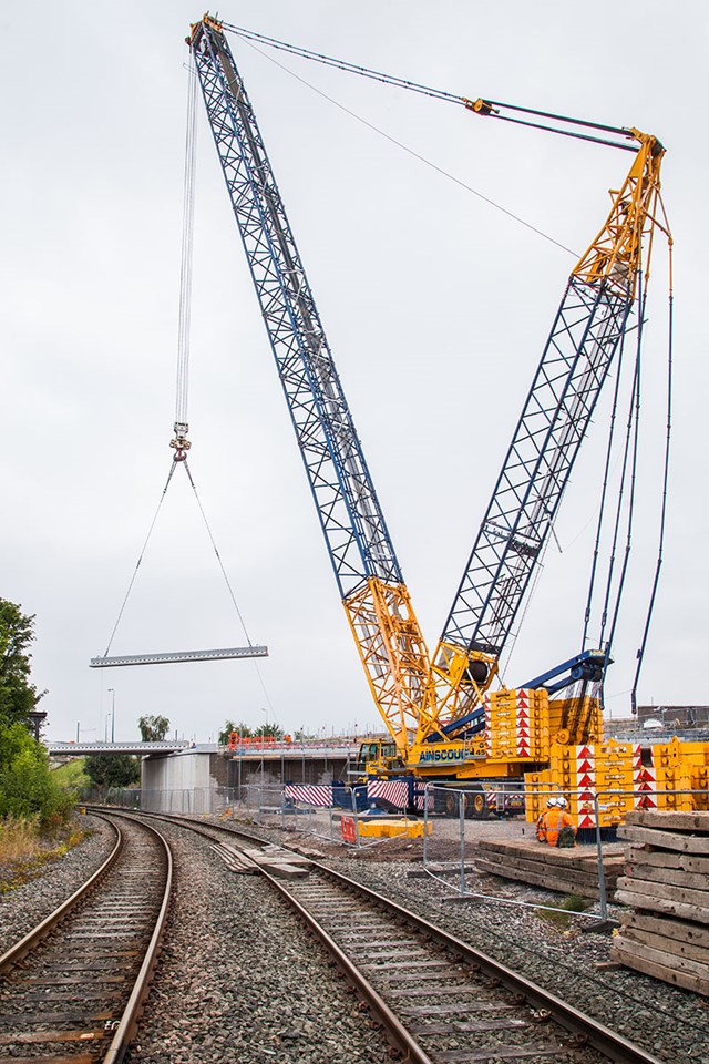A crane lifting parts of the new Richmond Street bridge into place