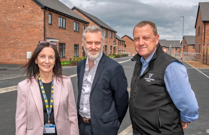 Swinnow housing 4: Madeleine Kenning (head of housing management, Leeds City Council), Councillor Peter Carlill (Leeds City Council’s executive member for transport and planning) and Kevin Busby (site manager, Willmott Dixon) at the new Hough Top housing development in Swinnow, near Pudsey.