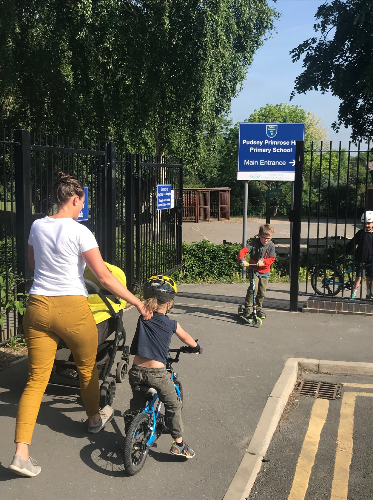 School Streets cycling family Primrose Hill Primary: Family using active travel to get to school.
