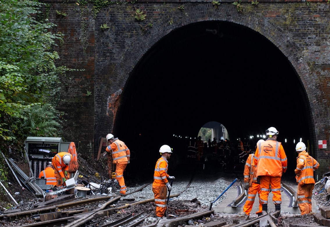 Salisbury Tunnel Junction - 111121: Signalling staff (left) and track workers ready the junction for reopening