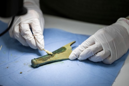 Conservator Bethan Bryan works on the Peebles Hoard. Photo © Duncan McGlynn (1)