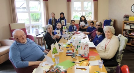 Care home residents welcome the pupils at the Cards for Kindness visit