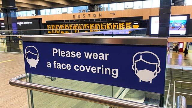 Tests show no traces of Covid-19 at four major railway stations: Euston station face covering signage stock shot