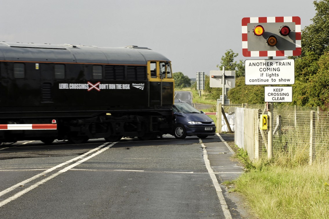 Top Gear - the collision: At a speed approaching 70mph a 107-tonne train branded with 'Level crossings: Don't run the risk' collides with car on alevel crossing in Lincs
