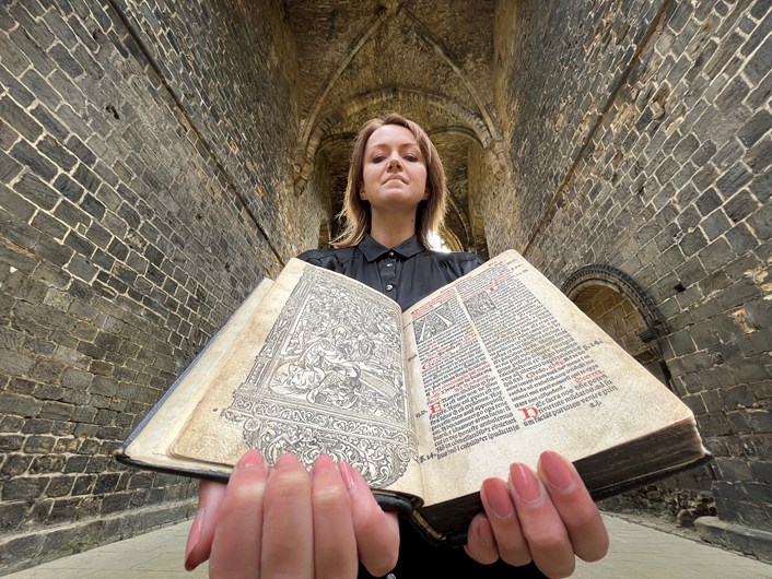 Kirkstall Missal: Senior librarian Rhian Isaac in Kirkstall Abbey with Leeds Central Library's precious copy of the Missale ad usum Cistercienci. Printed in Paris in 1516, the book is believed to have once belonged to the monks of Kirkstall Abbey and remarkably, it still contains notes and passages they delicately wrote by hand.