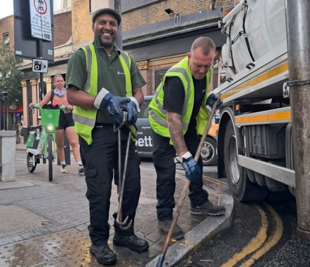 Street Cleaning Operatives Patrick Todd and Saadedin Suleiman clearing the street drainage in Angel