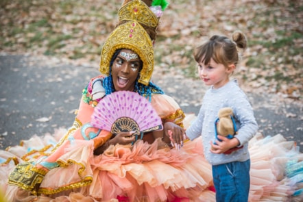 Hackney Carnival performer with child