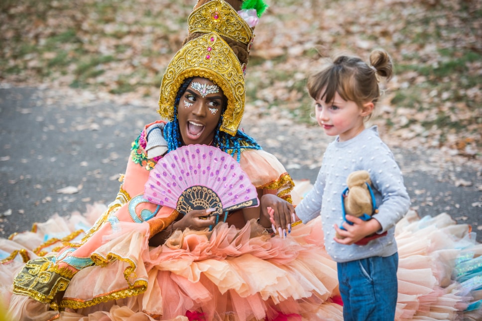 Hackney Carnival performer with child