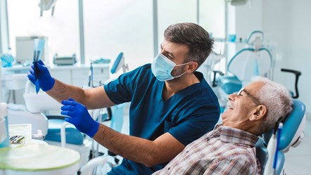 GettyImages-1369227721 (dentist and patient)