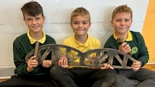 Students holding the replica of Barmouth viaduct: Students holding the replica of Barmouth viaduct